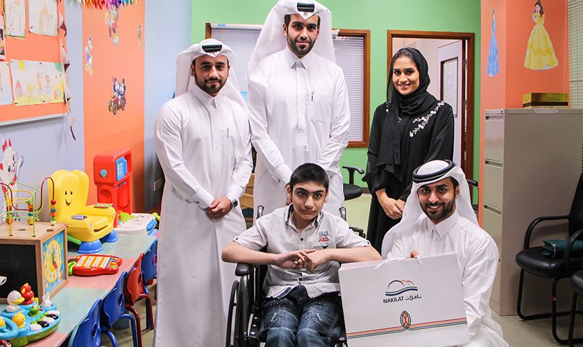 Nakilat PR Manager and Employees with Child Patient at Hospital