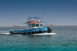 Tugboat in the midst of towage at the Ras Laffan Port